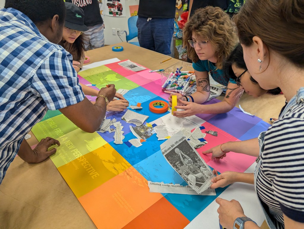 diverse students were locating newspaper of geopolitics on the South Up map